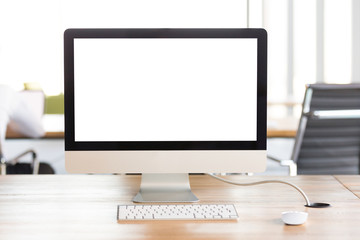 Mock up big monitor computer screen with keyboard on desk in office, mockup blank empty display at workplace table, device with copy space for business work software website application background