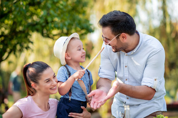 Happy family having fun in park