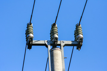 Silhouettes of High voltage pole and power lines