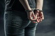 © appledesign - women handcuffed in criminal concept