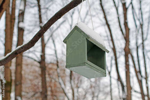 Empty Wooden Bird Feeder Hanging On A Tree In The Winter Park
