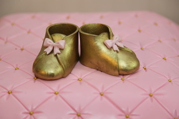 Gold baby shoes