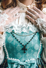 Beautiful Woman In Vintage Blue Dress. Cross. Victorian Lady. Elegant