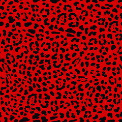 Seamless Faux Textured Jaguar Skin Pattern with black spots on bright red background. Vector EPS10 animal repeat surface pattern. Punk rock fashion pattern