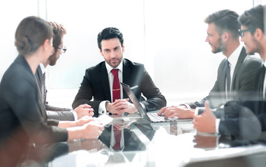 business team discussing a new project sitting at the Desk