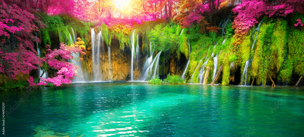 Exotic waterfall and lake landscape of Plitvice Lakes National Park, UNESCO natural world heritage and famous travel destination of Croatia. The lakes are located in central Croatia (Croatia proper). - obrazy, fototapety, plakaty 
