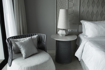 Luxury modern japanese style bedroom in grey and white colours. Luxury hotel room in a five star hotel.