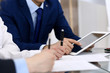 © rogerphoto - Businessman using laptop at meeting, closeup of hands. Business operations concept