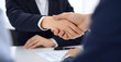 © rogerphoto - Group of business people or lawyers shaking hands finishing up a meeting , close-up. Success at negotiation and handshake concepts