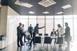 © alfa27 - Multiethnic business men dressed in formal wear and national arabian clothes debating vivaciously in conference room. Conflicts can be resolved with a good joke, panoramic view.