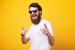 © Vulp - Hey you!You cool man! Bearded man, in sunglasses pointing finger and looking at camera