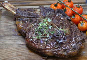 well seasoned beef rib eye steak on wood board