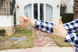 New home, house, property and tenant - Real estate agent handing a house key and showing thumbs up