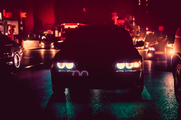 Night view of the cars. Road in the city at the night with yellow and red electrical light for cars during they are coming home. The cars compete at night. Only the lights of night carriages.