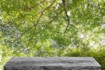 Wall Mural - wood table on green nature background