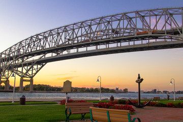 Blue Water Bridge Sunrise. Dawn over the towns of Port Huron, Michigan and Sarnia, Ontario on the US and Canadian border connected by the twin spans of the Blue Water Bridge.