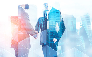 Poster - Two businessmen shaking hands in city