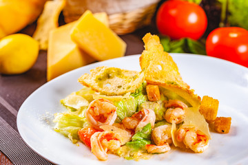 Wall Mural - Caesar salad with shrimps on white plate