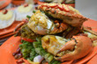 © MartinZizlavsky - Boiled giant crab served on an orange plate at the Temple Street night market in Hong Kong China