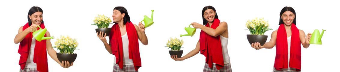 Young man watering flowers isolated on white 