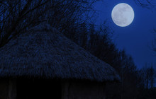 Primitive Hut With A Straw Roof By Night, Moon In The Sky, Nature Landscape Background