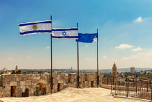 Three Flags Waiving On Top Of The Citadel Walls In Jerusalem.