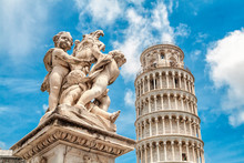 Leaning Tower Of Pisa With Sculture In Front, Italy.