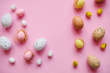 Wall Mural - Set of colored eggs on a pink background. Festive Easter concept.