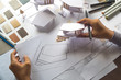 © Chaosamran_Studio - architect design working drawing sketch plans blueprints and making architectural construction model in architect studio