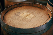 Close Up Of The Old Wooden Wine Barrels With Iron Hoops