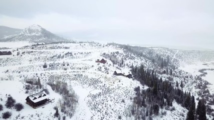 Fotobehang - Aerial view of rural mountain road in the Winter.