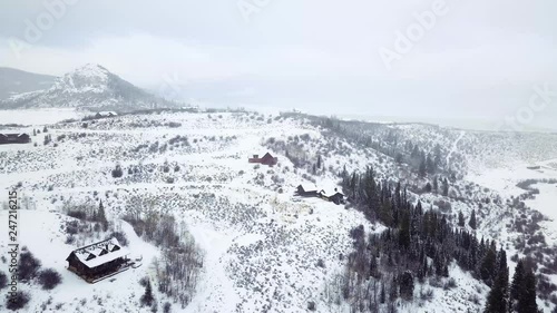 Fototapete - Aerial view of rural mountain road in the Winter.