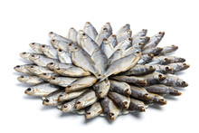 Large Heap Of Dried Salted Sea Roach Laid Out In The Form Of A Circle On A White Background