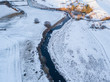 Aerial view of river runs through a snowy landscape. Scotland, UK