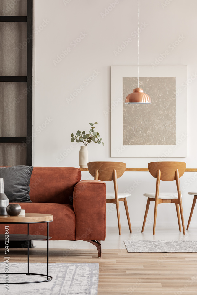 Open plan living and dining room interior with long table with chair ...
