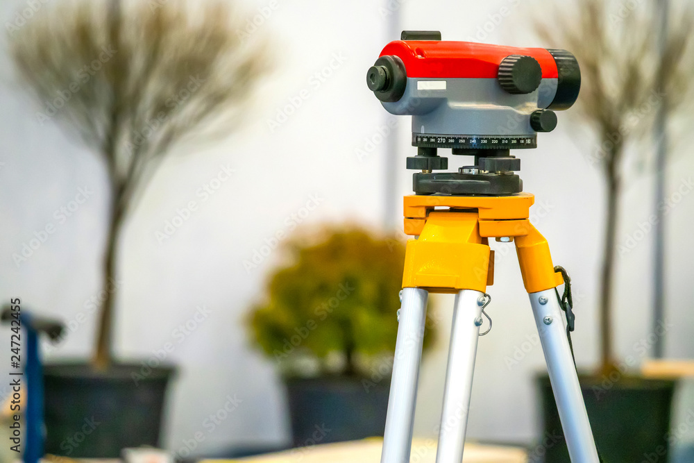 Geodetic device. Landscape work. Theodolite. Tree planting. Landscaping ...