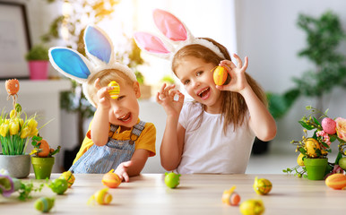 Wall Mural - Happy easter! funny funny children   with ears hare getting ready for  holiday