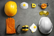 © New Africa - Flat lay composition with safety equipment and space for text on grey background
