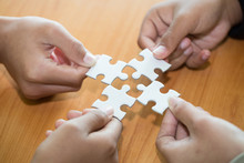 Many Persons Holding Pieces Of Jigsaw Puzzle,Teamwork Concept,,Business Connection,Success And Strategy Concept,Business Accounting