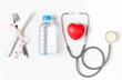 water and stethoscope with red heart isolated