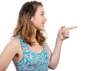 Poster - smiling young attractive woman pointing with her finger on copyspace