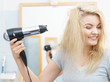 © anetlanda - Blonde woman using hair dryer