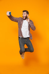 Sticker - Full length portrait of a cheerful young man