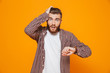 © Drobot Dean - Portrait of a shocked young man wearing casual clothes