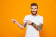 © Drobot Dean - Portrait of a cheerful young man wearing casual clothes