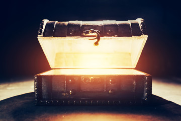 ancient wooden box with glowing light.