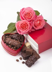 Canvas Print - rose and dark chocolate for valentine day on isolate white background.