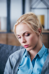 Wall Mural - selective focus of beautiful sad woman at home