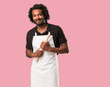 © Asier - Handsome african american baker crossing his arms, smiling and happy, being confident and friendly
