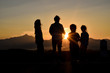 © banphote - Silhouette of a happy family at sunset.